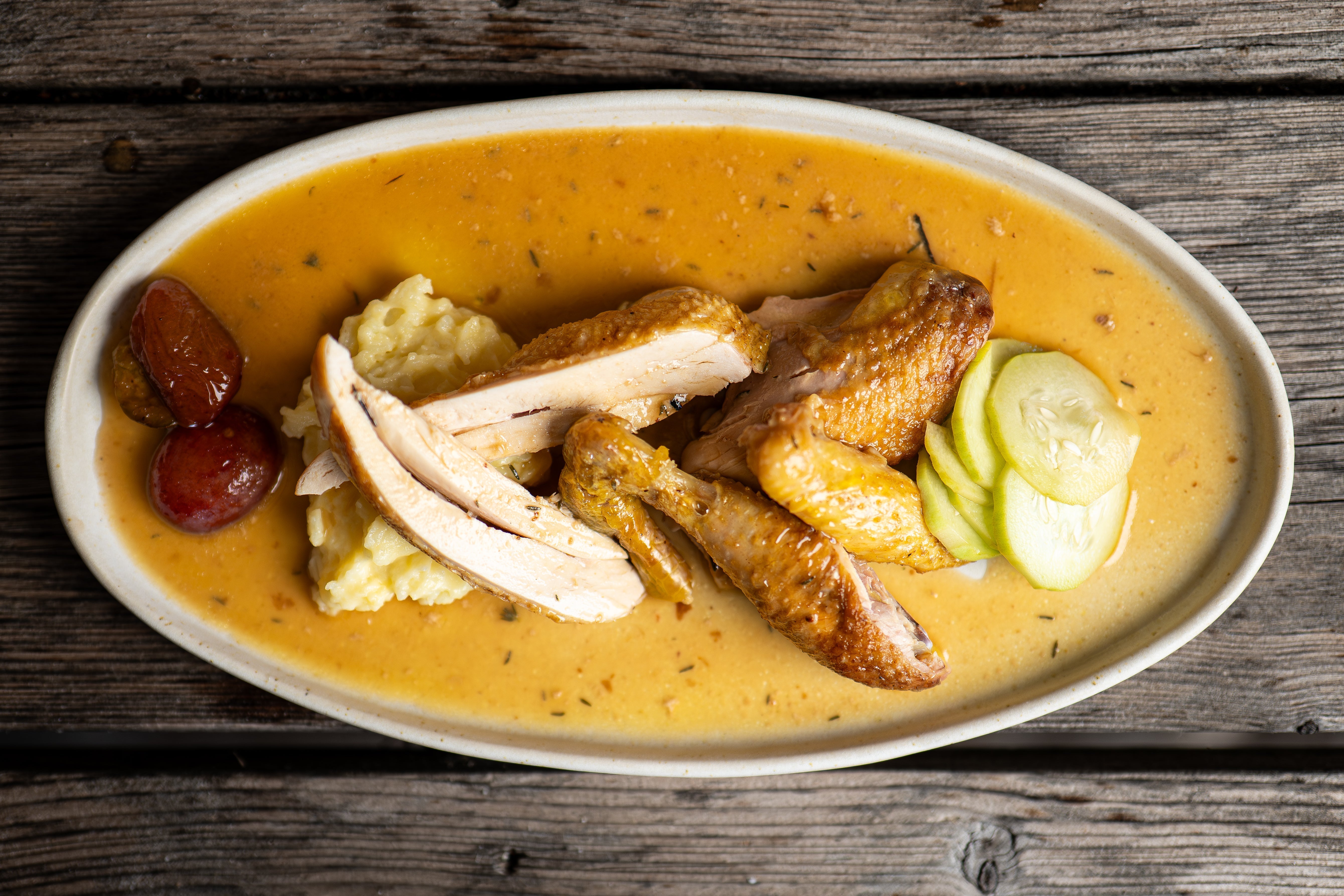 Chicken danoise with pickled cucumbers and plums