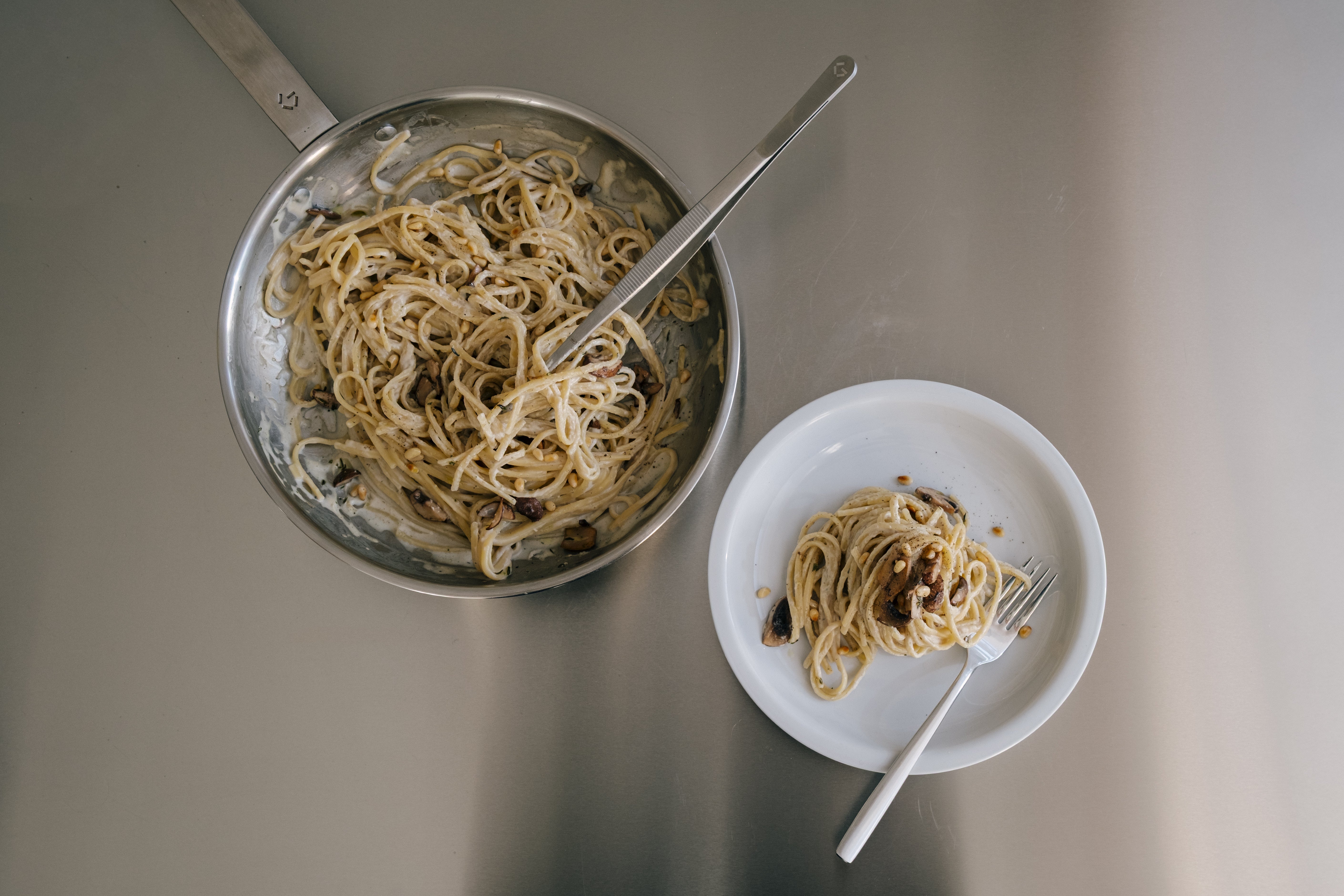Linguine with mushroom and ricotta sauce, topped with toasted pine nuts